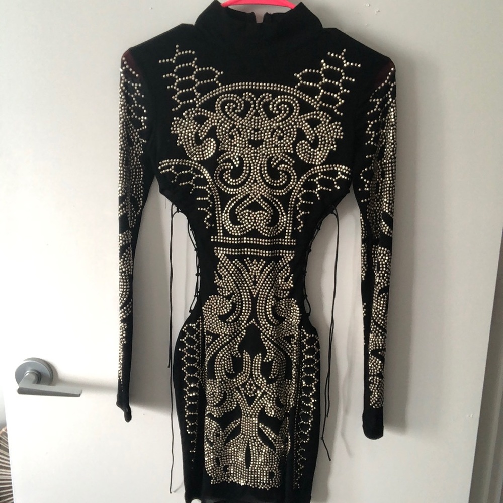 Black with gold embellishment, cut out dress